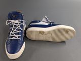 blue and white high top sneakers with laces on the sole