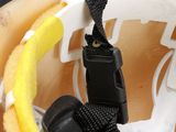 a close up of a helmet with a strap on it