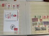 an open book with stamps on it sitting on a table