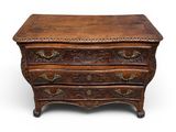 an old chest of drawers with ornate carvings on the drawers