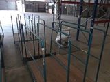 a large warehouse with a lot of shelves and pallets on the floor
