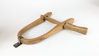 a pair of pliers on a white surface