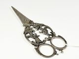 a pair of scissors that are sitting on a table