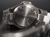 a close up of a watch on a table