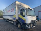 a picture of a delivery truck parked in front of a building