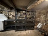 a refrigerator and a refrigerator freezer in a dirty room