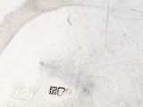 a close up of a white plate with a bird on it