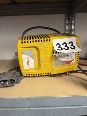 a small yellow machine with a price tag on it