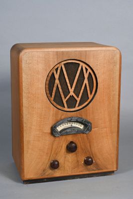 a small wooden radio with a vw logo on it
