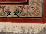 a rug with a picture of birds on it on a wooden floor