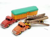 three toy trucks that are sitting next to each other