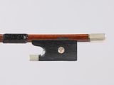 a close up of a violin bow on a white background