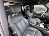 the interior of a car with two rows of seats and a center console