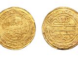 two gold coins with arabic writing on them