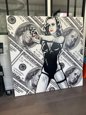 une photo d'un tableau représentant une femme avec de l'argent dessus