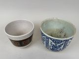 two cups sitting next to each other on a table