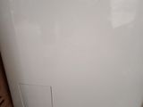 an image of a small white refrigerator in a kitchen