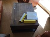 a coffee table with a book on top of it in a living room