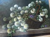 a picture of a basket of flowers on the floor