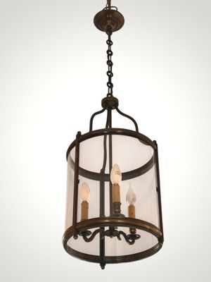 an image of a chandelier with three lights hanging from the ceiling
