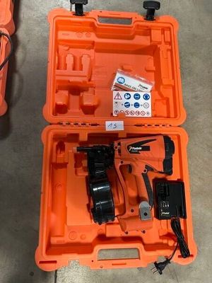 an orange tool box with tools in it sitting on the floor