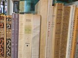 many old books on a shelf in a library