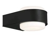 un gros plan d'un luminaire noir émettant une lumière blanche