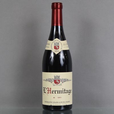 a bottle of wine that is sitting on a table