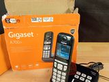 a phone that is sitting on a table next to a box