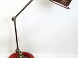 a lamp that is on top of a wooden stand