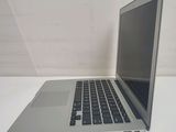 a laptop computer sitting on a table with a white background