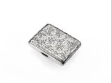 an antique silver cigarette case on a white background