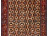an antique persian rug with a red and blue design