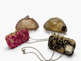 several different types of purses are lined up on a white surface