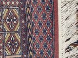 a close up of a rug with fringes on top of it