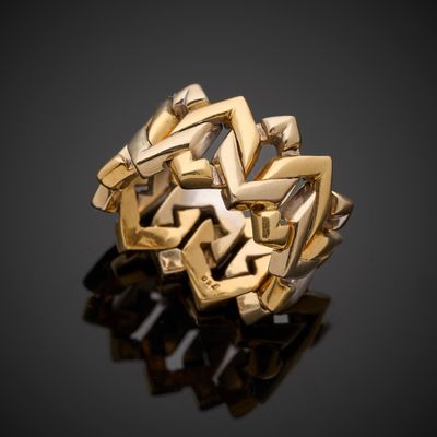 a close up of a gold ring on a black surface