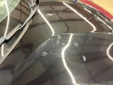 a close up of a car ' s windshield with scratches on it