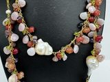 a close up of a necklace on a mannequin mannequin