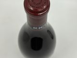 a bottle of wine that is sitting on a table