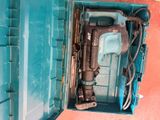 a blue tool box with a hammer inside of it