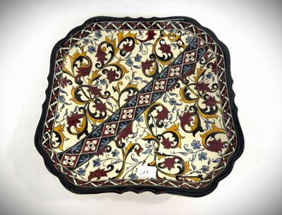 a decorative plate with a design on it on a white surface