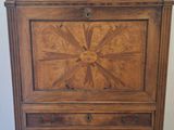 a wooden dresser with a mirror on top of it