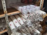 many rolls of paper on the shelves in the room
