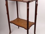 a small wooden table with a shelf on top of it