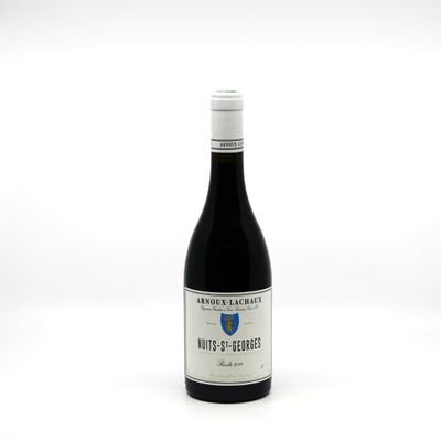 a bottle of wine that is sitting on a table
