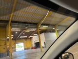 a view of a building from inside of a car