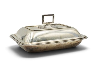 an old silver covered dish with a handle on a white background