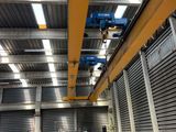 a crane that is hanging from the ceiling of a building