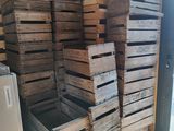 many wooden crates stacked on top of each other