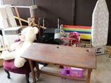 a teddy bear sitting on a chair next to a desk
